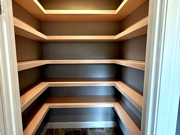 Walk-in pantry with wraparound shelves